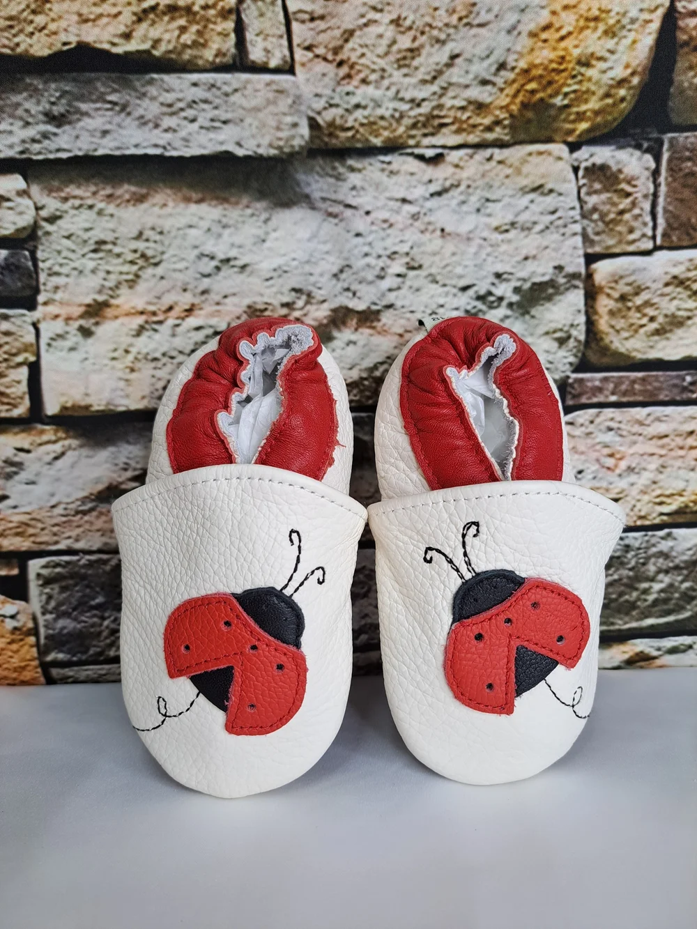 Baby White Leather Slip-On Shoes with Red Ladybug Detail